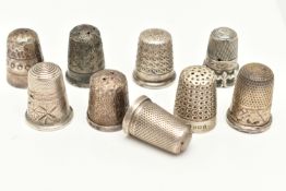 A SMALL BAG OF SILVER AND WHITE METAL THIMBLES, to include six with full British hallmarks for