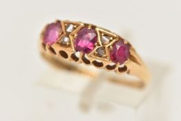 AN EARLY 20TH CENTURY 18CT GOLD RUBY AND DIAMOND RING, set with three oval cut rubies, interspaced