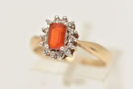 A 9CT GOLD CLUSTER RING, of a rectangular form, set to the centre with a rectangular orange stone,