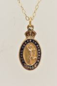 A YELLOW METAL 'ROYAL CORPS OF SIGNALS' PENDANT, with enamel detail, approximate length 18mm,