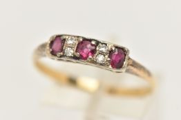 A YELLOW METAL RUBY AND DIAMOND RING, ring head of a rectangular form set with three oval cut