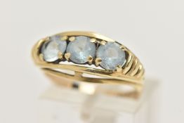 A 9CT GOLD THREE STONE RING, set with three circular cut pale blue stones, each has heavy abrasion