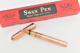 A 'MABIE TODD & CO' YELLOW METAL 'SWAN' FOUNTAIN PEN, a boxed yellow metal fountain pen with