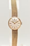 A 9CT GOLD 'GARRARD' LADIES WRISTWATCH, manual wound movement, round white dial signed 'Garrard',