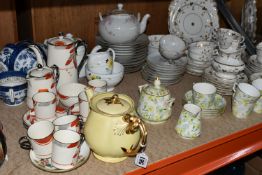 A COLLECTION OF CERAMIC TEA WARE, comprising of late 19th century white and gold gilt vine design