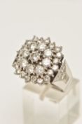 A DIAMOND CLUSTER RING, designed as a three tier cluster of claw set brilliant cut diamonds, to