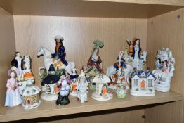 A GROUP OF MAINLY STAFFORDSHIRE FIGURES AND COTTAGES, to include a flatback figure group of two