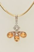 A CITRINE AND DIAMOND PENDANT ON A CHAIN NECKLACE, the pendant designed as a central cluster of