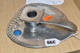 AN ARCHIBALD KNOX FOR LIBERTY PEWTER CHAMBER STICK, with candle insert, strap handle and foliate