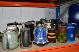 A GROUP OF LATE NINETEENTH-EARLY TWENTIETH CENTURY CERAMIC PITCHERS comprising twenty-one pitchers