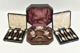 A CASED SET OF FOUR SILVER OPEN SALTS, AND TWO CASED SETS OF SILVER SPOONS, the late Victorian