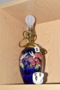 A MOORCROFT POTTERY TABLE LAMP, in 'Anemone' pattern on a blue ground, impressed marks to base,
