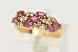 AN 18CT GOLD RUBY AND DIAMOND RING, set with seven oval cut rubies and small round brilliant cut