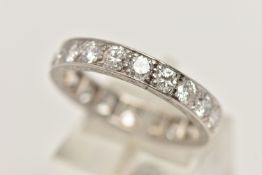 A MID 20TH CENTURY WHITE METAL DIAMOND FULL CIRCLE ETERNITY RING, set with approximately twenty