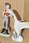 TWO HOLLOHAZA PORCELAIN FIGURES, the Hungarian figures of a young man with an axe and a goose with