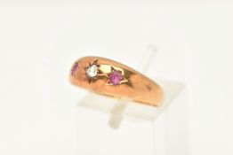 A LATE VICTORIAN 15CT GOLD DIAMOND AND RUBY THREE STONE RING, set with a rose cut diamond and two