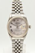 A 'ROLEX' OYSTER PERPETUAL DATEJUST, automatic movement, round silver tone dial, signed 'Rolex'