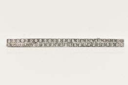 A DIAMOND BROOCH, of rectangular outline, set with two rows of old cut diamonds each within a square