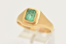 A GENTS 18CT GOLD, EMERALD RING, set with an emerald cut emerald, measuring approximately in mount