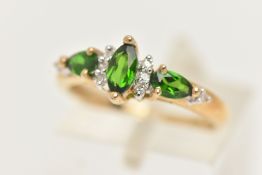A 9CT GOLD GEM RING, designed as a central marquise shape green gem flanked by single cut diamonds