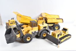 FOUR UNBOXED PLAYWORN MIGHTY TONKA TOYS CONSTRUCTION VEHICLES, shovel and dump trucks are later