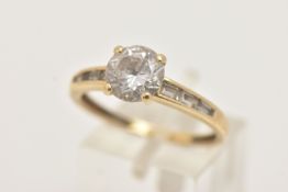 A 14CT GOLD CUBIC ZIRCONIA RING, set with a central circular cut colourless cubic zirconia, and