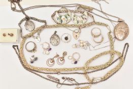 AN ASSORTMENT OF WHITE METAL JEWELLERY, to include a large silver foliate pattern locket, hallmarked
