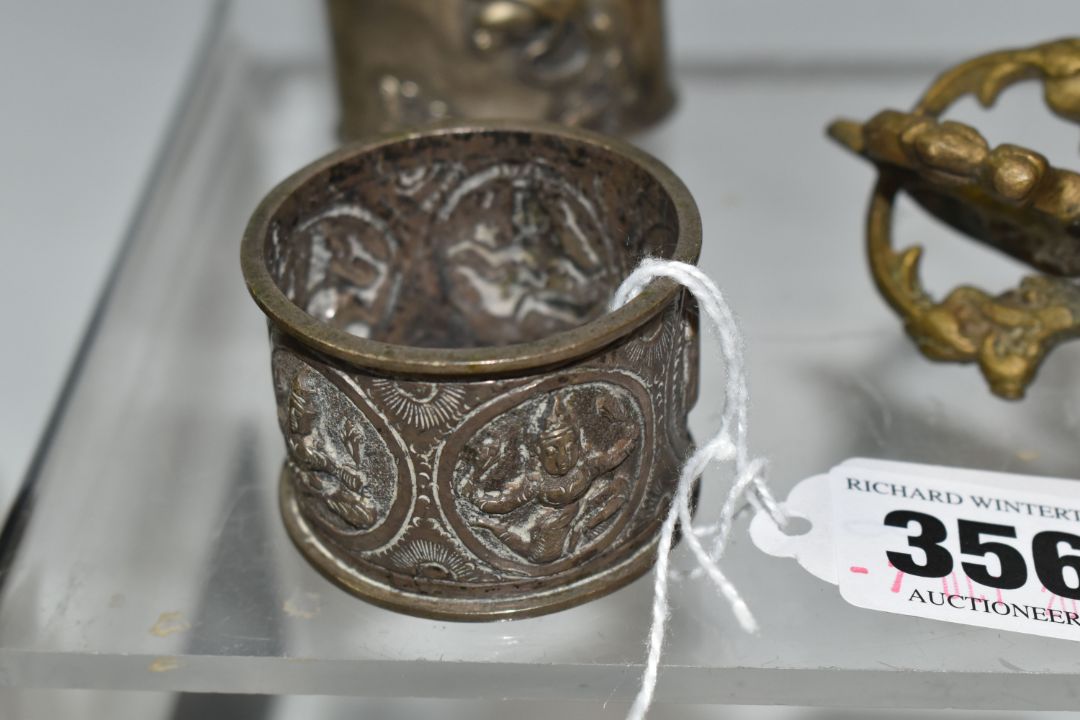A GROUP OF ASIAN METAL WARE, possibly Tibetan and Indian in origin, comprising a napkin ring - Image 6 of 9