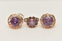 A SYNTHETIC COLOUR CHANGE CORUNDUM RING AND EARRINGS, the ring set with a circular shape synthetic