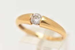 AN 18CT GOLD SINGLE STONE RING, set with a colourless circular cut cubic zirconia, tension set to