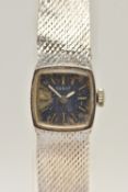 A LADIES 9CT WHITE GOLD 'TISSOT' WRISTWATCH, manual wind, very worn blue square dial signed 'Tissot'