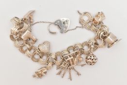 A SILVER CHARM BRACELET, triple textured circular links, fitted with a heart padlock clasp,