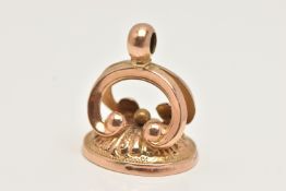 A YELLOW METAL FOB, an oval fob with scrolling detail, unmarked, approximate gross weight 3.8 grams,