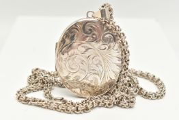 A LARGE OVAL SILVER LOCKET WITH CHAIN, foliate pattern, opens to reveal two vacant compartments,