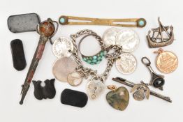 A SMALL BAG OF ASSORTED ITEMS, to include a white metal Viking ship brooch stamped 'Silver' fitted