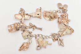A CHARM BRACELET, the curb link bracelet suspending fourteen charms, to include a hinged church, a