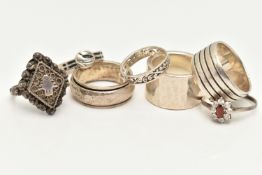SEVEN SILVER AND WHITE METAL RINGS, to include a filigree hinged 'poison' ring, a cubic zirconia
