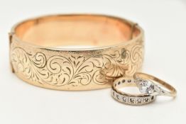 A ROLLED GOLD HINGED BANGLE AND TWO RINGS, the wide foliate designed hinged bangle fitted with a