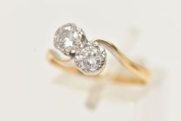 A TWO STONE DIAMOND RING, a toi et moi design ring, two round brilliant cut diamonds in a white