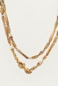 A VICTORIAN YELLOW METAL LONG GUARD CHAIN WITH HAND CLASP, fancy link chain made up of open work