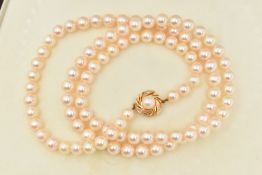 A CULTURED PEARL NECKLACE, a long string of cultured pearls, approximate pearl diameter 6.7mm,