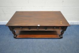 A LATE 20TH CENTURY MAHOGANY COFFEE TABLE, with three frieze drawers, raised on turned legs,