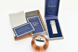 A 'CHRISTIAN DIOR' AND A 'RONSON' LIGHTER, a white metal lighter with repeating 'C D' pattern,