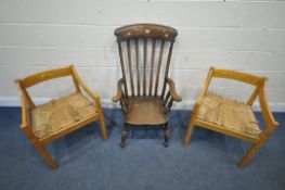 A 20TH CENTURY OAK ARMCHAIR, with swept armrests, raised on turned legs, united by stretchers, along