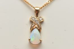 A 9CT GOLD OPAL AND DIAMOND PENDANT AND CHAIN, designed as a pear shape opal cabochon beneath a