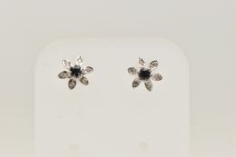 A PAIR OF 18CT WHITE GOLD SAPPHIRE AND DIAMOND CLUSTER STUD EARRINGS, each of flower design with a