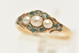 A YELLOW METAL GEM SET RING, set with a row of three cultured split pearls, in a surround of cushion