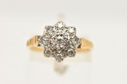 A DIAMOND CLUSTER RING, designed as a central brilliant cut diamond in a star setting, within a