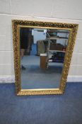 A GILT FRAMED RECTANGULAR BEVELLED EDGE WALL MIRROR, 105cm x 75cm (condition report: small chips