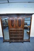 WARING OF OXFORD STREET LONDON, an early 20th century mahogany compactum wardrobe, with two bevelled